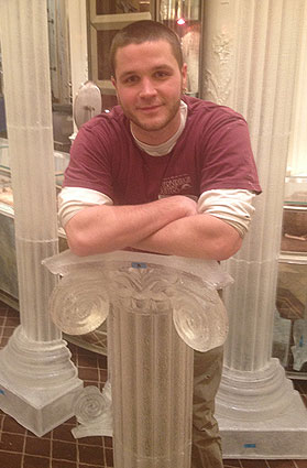 Chris Bell ’11 with the resin-cast columns he made for the Bergdorf Goodman holiday display. The columns were made to look like they’re carved from ice.