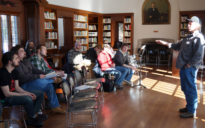 Composer David Rakowski sharing his craft with composition students in the historic Eugene Savidge Memorial Library at the MacDowell Colony (Jonathan Gourlay photo)