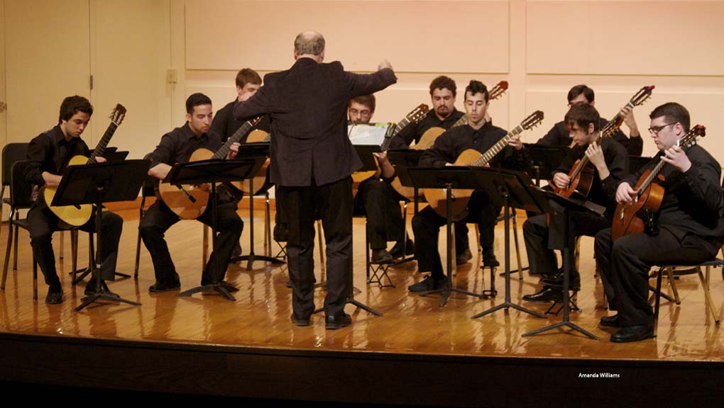 Jose Lezcano directs the Guitar Orchestra and Latin American Ensembles.