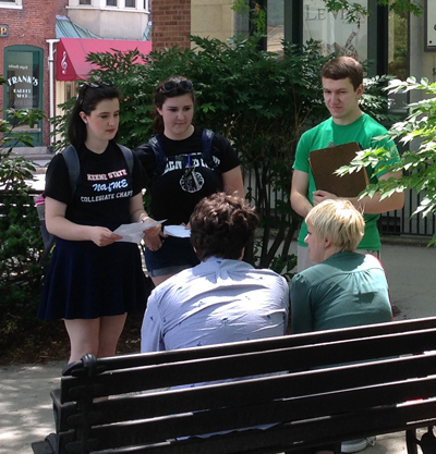 Students Lauren Casey, Amy Lesieur, and Jonathan Way (l–r) survey Keene residents on how they view art in the community.