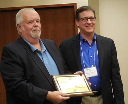 Gary Guzouskas (left) received the Richard Kay Memorial Award from William Van Tassel, Manager, Driver Training Programs, AAA National Office, in Portland, ME.
