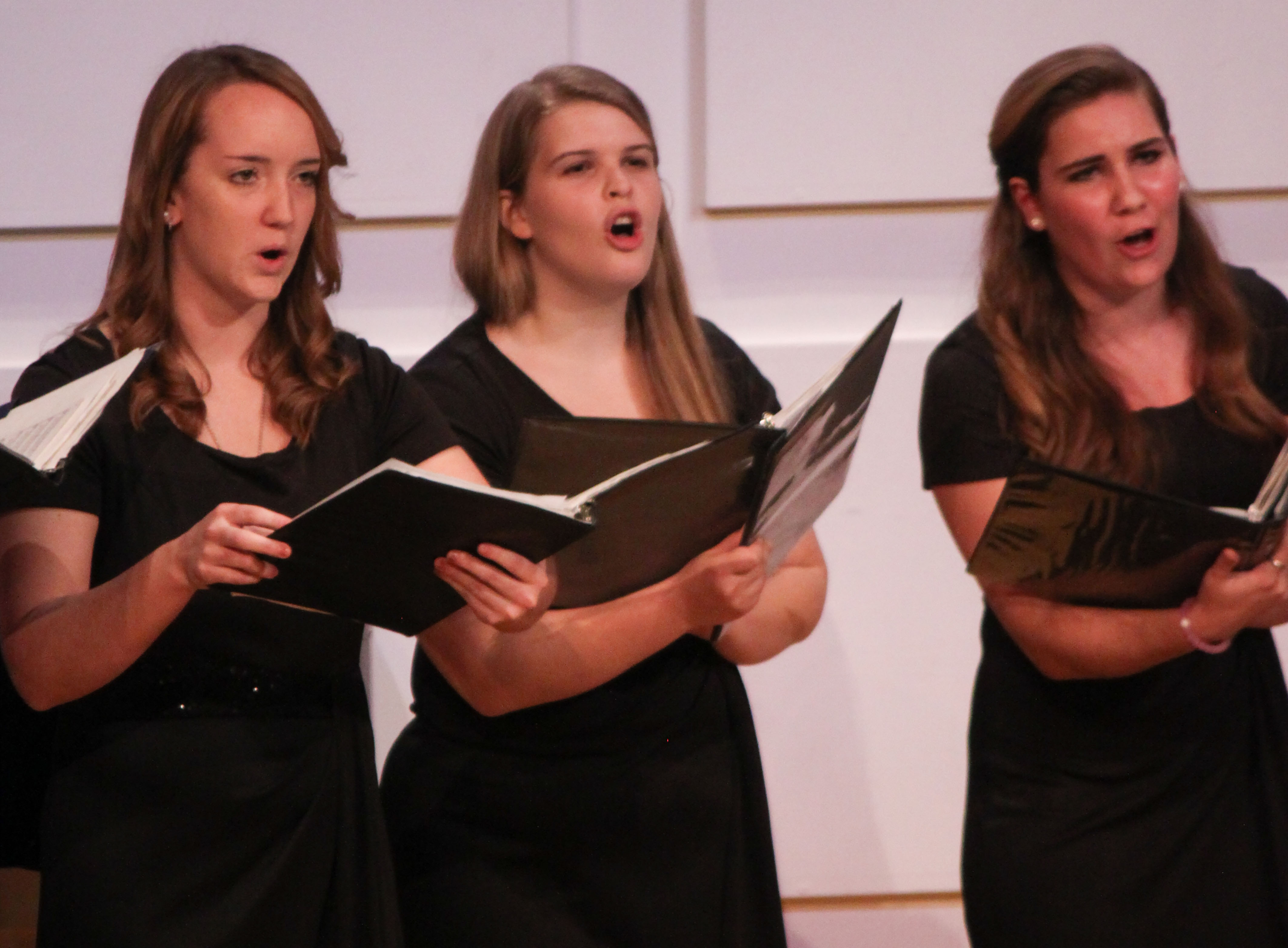 Local high school students perform choral works.