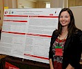 Emily Wollert giving a poster presentation