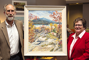 Jamie Trowbridge and Keene State President Anne Huot with BeaTrix Sagendorph's painting of Mt. Monadnock and Dublin Lake