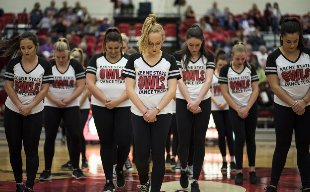 The dance team takes the court at a Keene State men's basketball game.