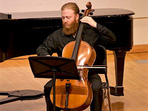 A cellist performs with the String Ensembles.
