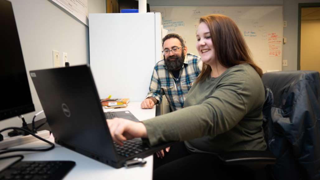 Student working with professor