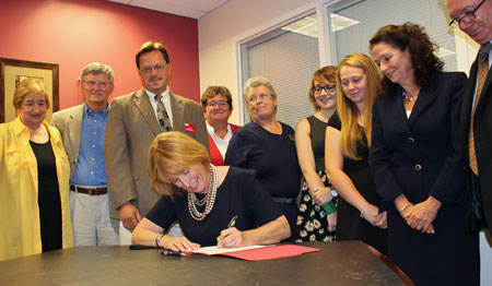 Governor Hassan signing HB 1444 into law