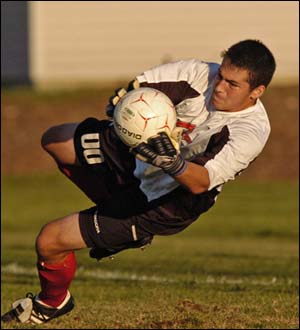 Cal Mintz makes a save for the Owls