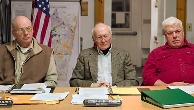 This photograph shows the Lee, New Hampshire Board of Selectmen, January 27, 2003 (L to R) Dwight Barney (Chairman), Joseph Ford, and Richard Wellington from the book "Meetings", by photographer Paul Shambroom