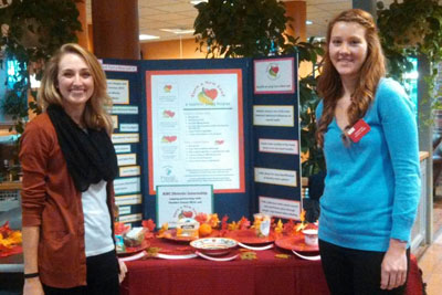 KSC Dietetic Interns Julia Whelan (at left) and Cassandra Reynolds with the Turn a New Leaf display at  Food Day 2014.