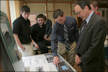 Jay Kahn, vice president for Finance and Planning, talks with Architecture students in the Communicorps program about their Expo Center design for the City of Keene and the College. Photo: Annie Card