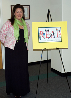 Lynn Roman; Graphic Design student Kayla Aucoin with the 2009 READ poster.