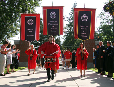 Photo: Annie Card; Drummer Christopher Meyer 2011, led the parade of entering KSC students down Appian Way for the opening of New Student Convocation on August 27.
