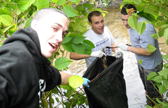 Photo: Zack Hawkins; Chi Phi fraternity members collected eight bags of debris at Beaver Brook as part of the Source to the Sea cleanup, October 3. (Lynn Roman photo.)