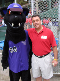 Owl soccer coach Bert Poirier with Swamp Bat mascot, Ribby.