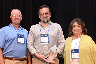 L-R: Last year's award winner, Gregg Kaufman, Instructor and ADP Campus Coordinator at Georgia College, Dr. Patrick Dolenc, and Barbara Burch, namesake of the award.