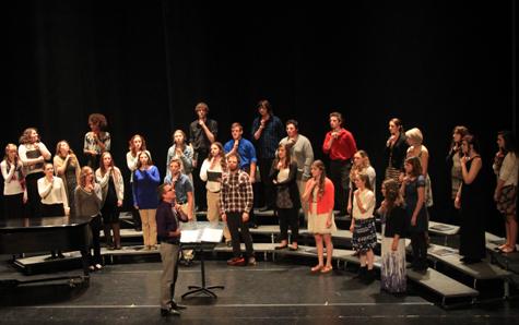 Assistant Professor of Music, Daniel Carberg demonstrates proper physical alignment and vocal technique to singers to the Winnisquam Regional High School Chamber Singers. (Photo by Amanda Williams)