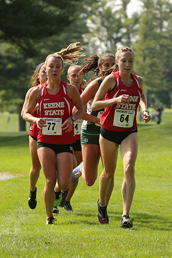 Kait Wheeler '15 (front left) and Sammy Goldsmith '15 (front right) at a cross country competition.