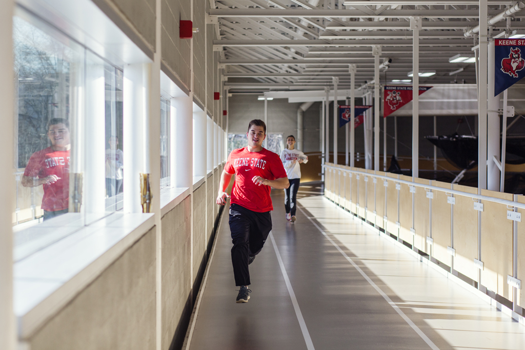 Students run on the indoor track at the Recreation Center. Photo by Will Wrobel.