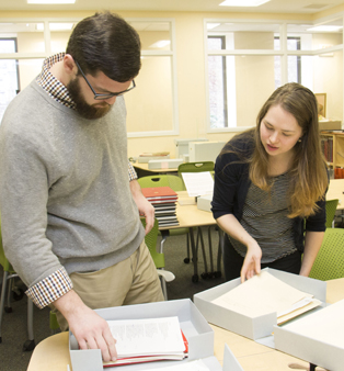 Keene State archivists Brantley Palmer and Hayley Lamberson with the NH Poets Laureate Collection