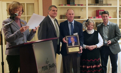 L–R: Cindy Chagnon, NH Board of Education (reading); Austin Garofalo, principal at Gilbert H. Hood Middle School and president​, NHASP; Brian Pickering, principal, ConVal Regional High School; Peggy McAllister, executive director, NHASP; Corey LaRoche, representative, Jostens