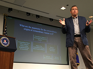 Dr. Waller addressing special agents and analysts at FBI Headquarters