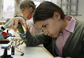 Young girl doing science project