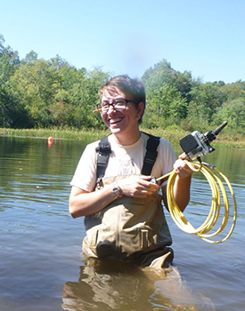 Environmental Studies student Andy Marion using underwater photography to monitor impounded sediment prior to removal of the Millie Turner Dam