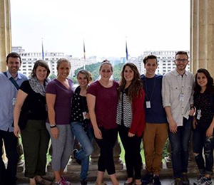 On location at the Romania Parliament Building (l–r):  Dr. Niall Moran, Dr. Carolyn Keller, Emma Hamilton, Rachel Reekie, Colleen Fortier, Amber Perkins, Tyler Croteau, Max Cucchi, Samantha Brault  (photo by Sam Brault)