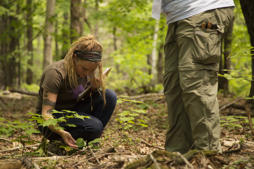 Senior environmental studies major Victoria Drake (left) and the Harris Center's Jill Weiss collect data for the Harris Center's conservation efforts. Photo by Will Wrobel