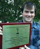 John Derba ’13 with his 39th Boston New England Emmy Award