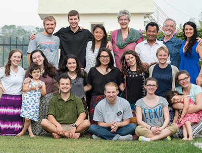 Drs. Gebauer and Fleischer with their students in Nepal with Siena Fleischer, a USAID officer and the daughter of Keene State professor Len Fleischer. (Front row, l–r) Brenden Jones, James Spineti, Mary D'Orvilliers (middle row, l–r) Courtney Dillon, Alli Sweeney, Hannah Rettig, Inja Diamond, Rose Lovett, Hannah Sousy, Olivia Miller (holding little girl) (back row, l–r) Josh Noury, Ben Weidman, Abby Wilcox, Professor of Environmental Studies Renate Gebauer, Krishna Gurung, Dr. Len Fleischer, Siena Fleischer (the two little girls are Siena's daughters, Naima Fleischer Castro and Ofelia Fleischer Castro)