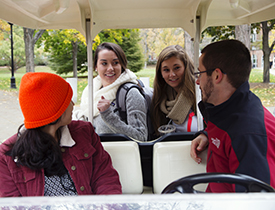 Conduct Cab driver Cory Davis (far right) and RD Jess Yon (far left) test Erin Keefe's and Jenna Imbrogna's (l–r) knowledge of the Student Code of Conduct.