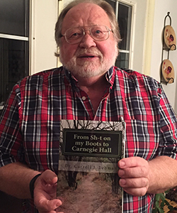Music Professor Emeritus Carroll J. Lehman with his new book