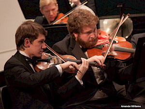 Student string players in KSC Orchestra.