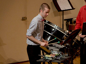 Students performs on drums in the Percusion Ensemble.