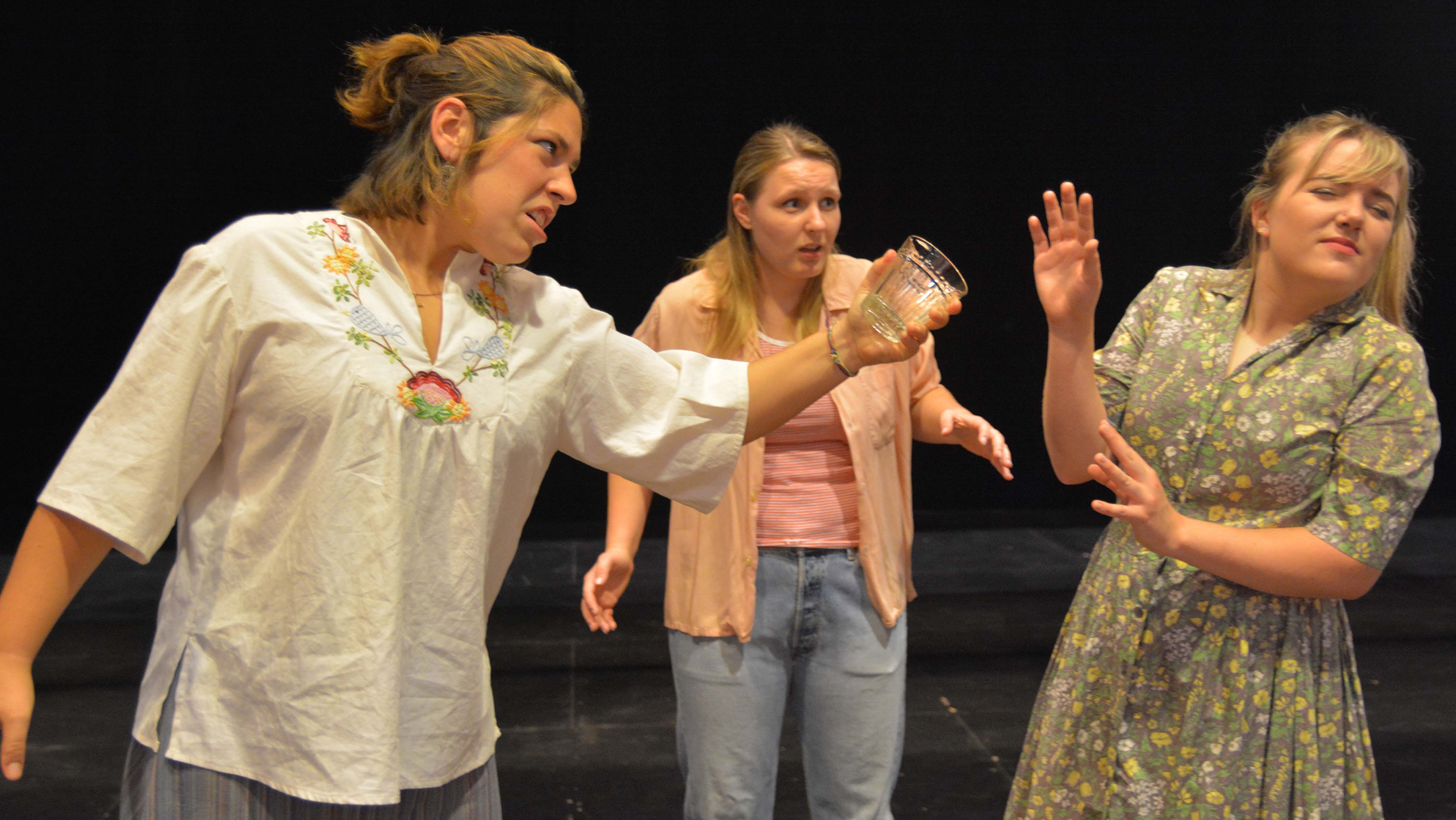 Keene State College students (from left) Dominque Pascoal, Ashley Gage, and Ashley Rollend perform in 