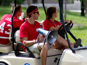 Students in a golf cart during Orientation