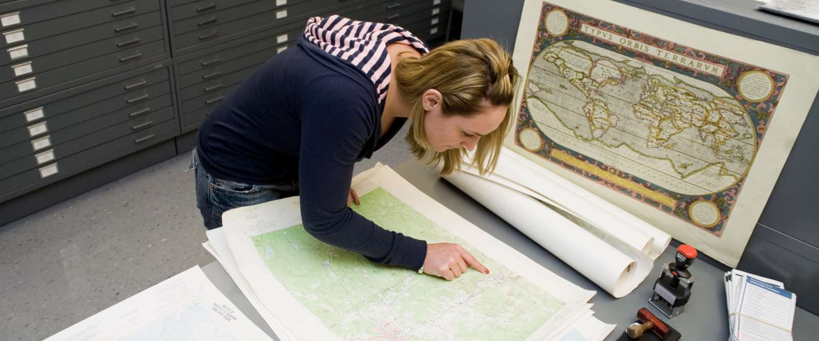 Student examining map