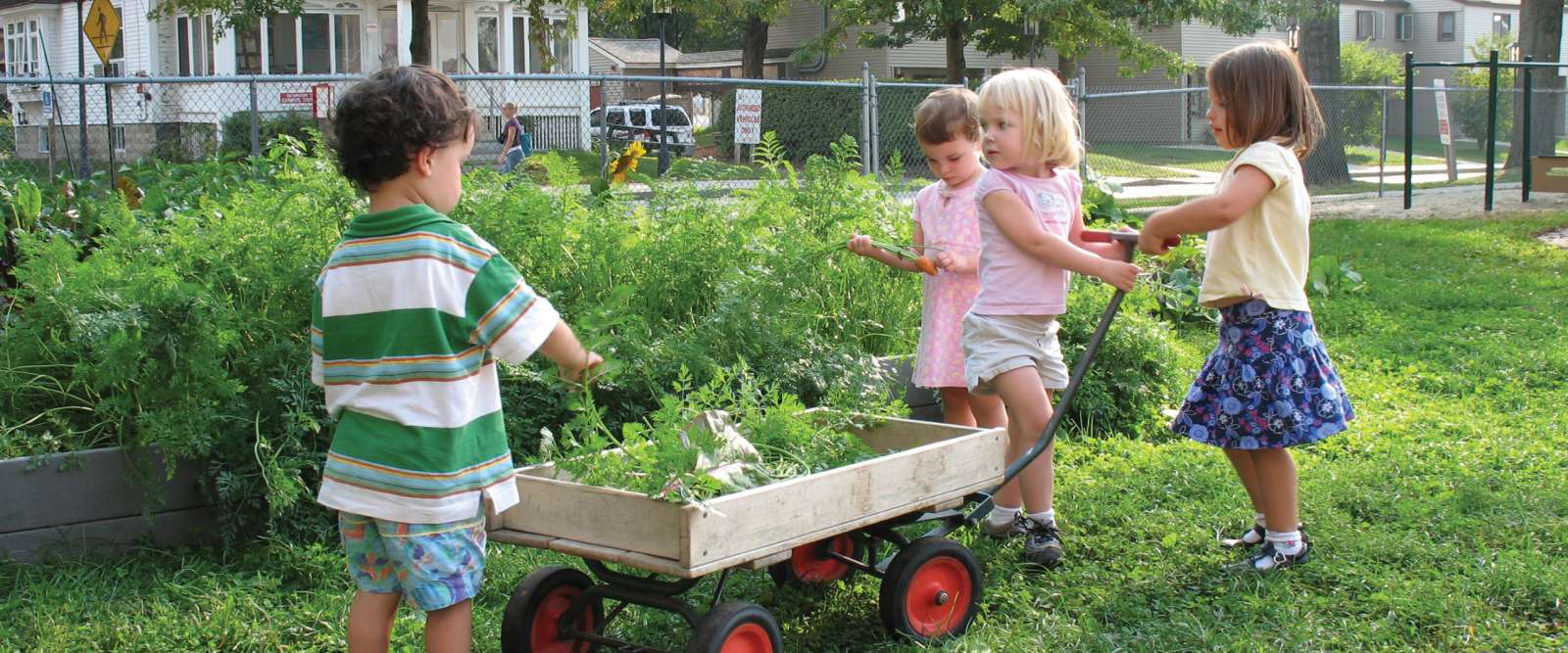 Kids with yard cart at the CDC