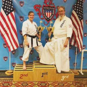 Amelia Gallup, left, on the podium