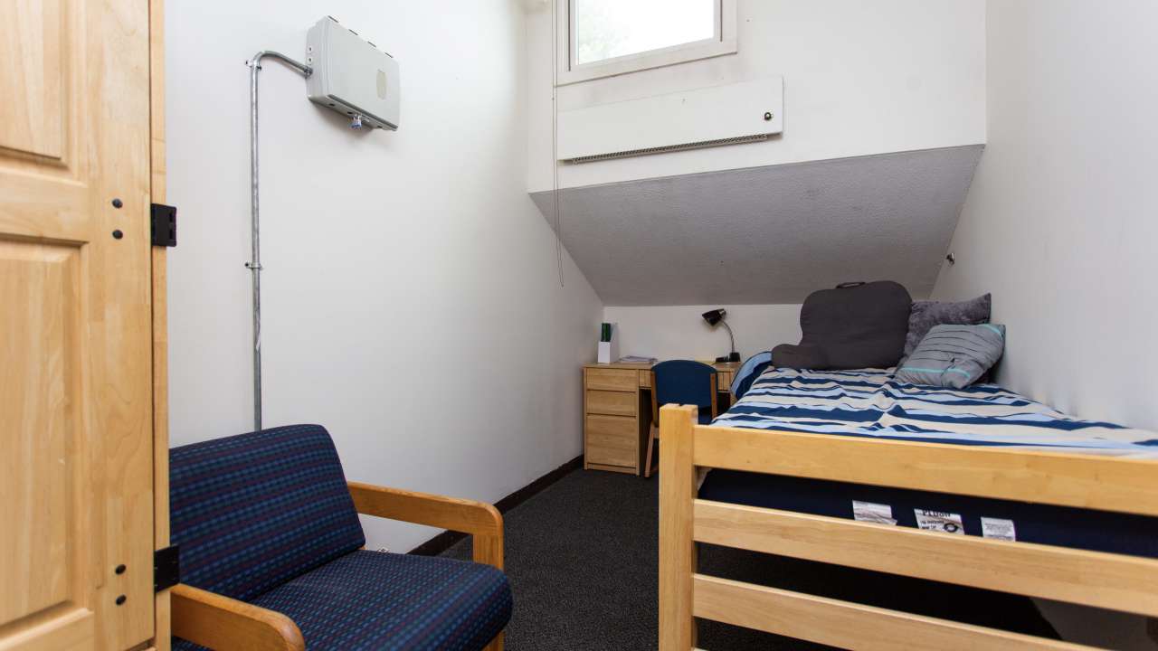 Owl's Nest dorm room, showing bed and window