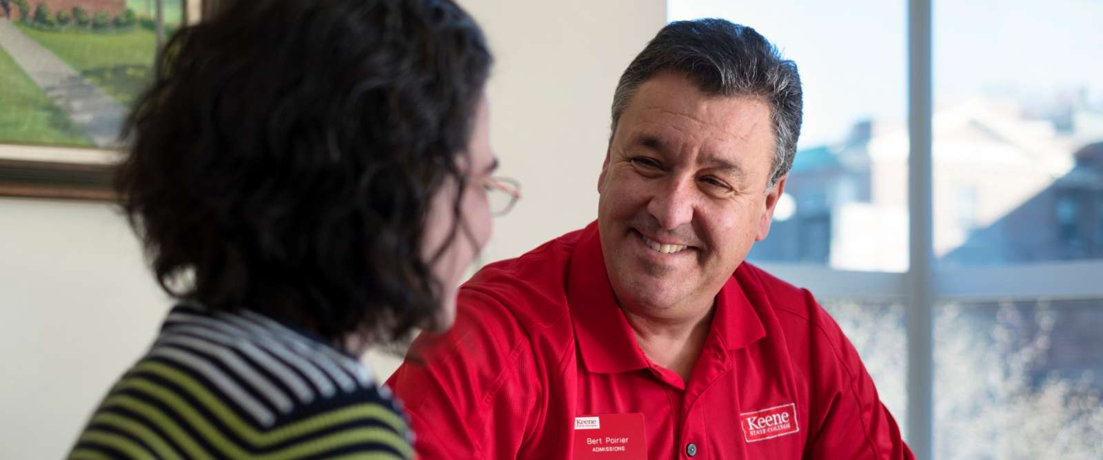Bert Poirier working with a student