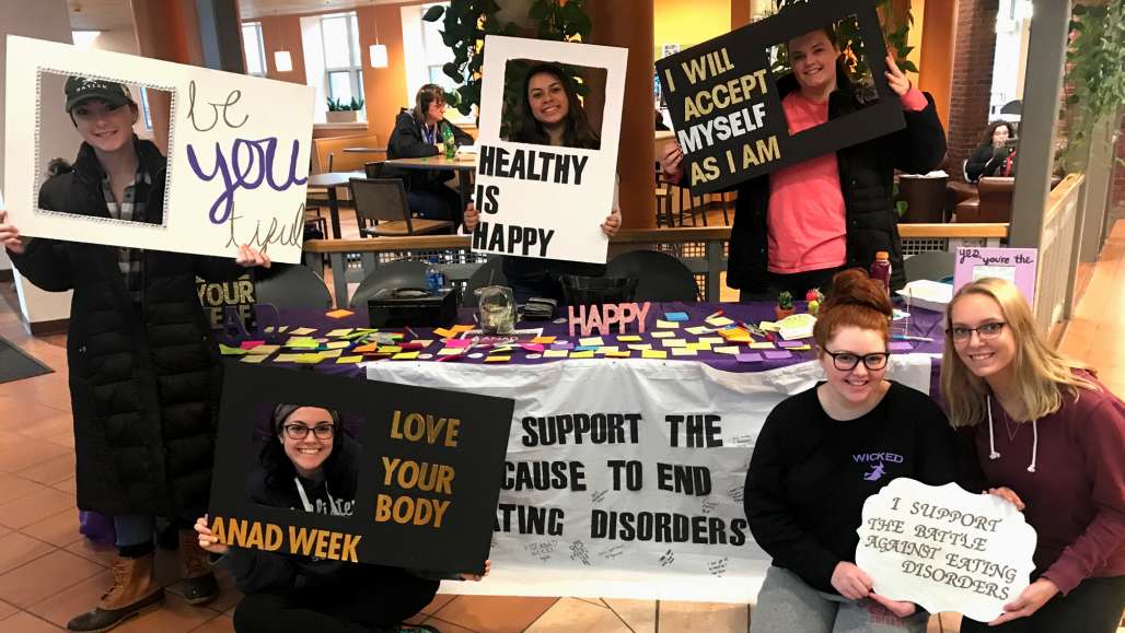 Rachel Zawaski, Marnie Anair, Brianna Braverman, Meaghan Cullinane, Taryn Sunstrom, and Emily Gosselin tabling in the Student Center for Eating Disorder Awareness Week in 2018.