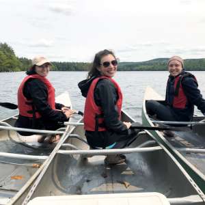 From left, Katelyn Fournier, Kristina Tufo, and Julia Yates doing conservation easement monitoring on Spoonwood Pond.