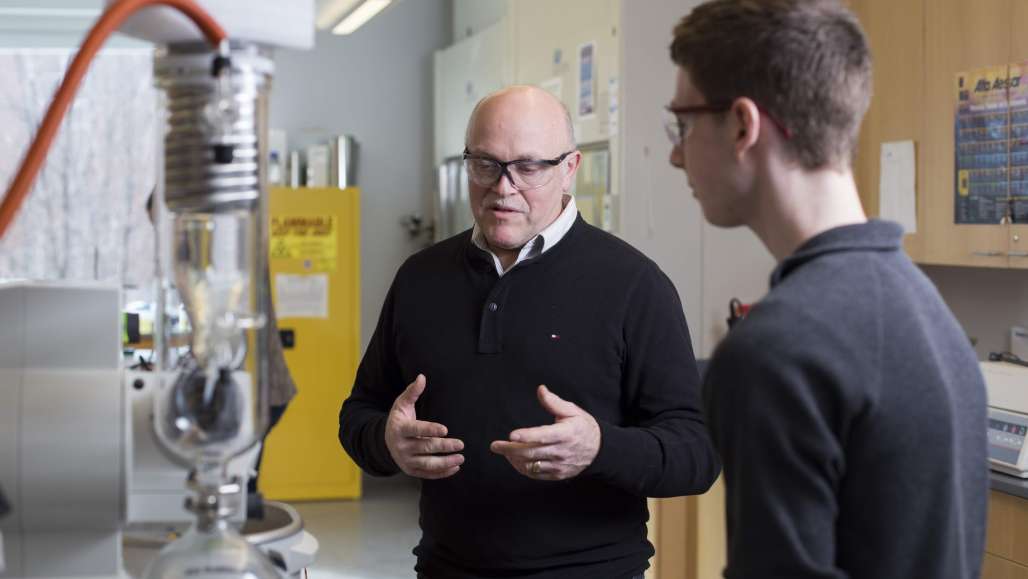 Professor and student in science lab