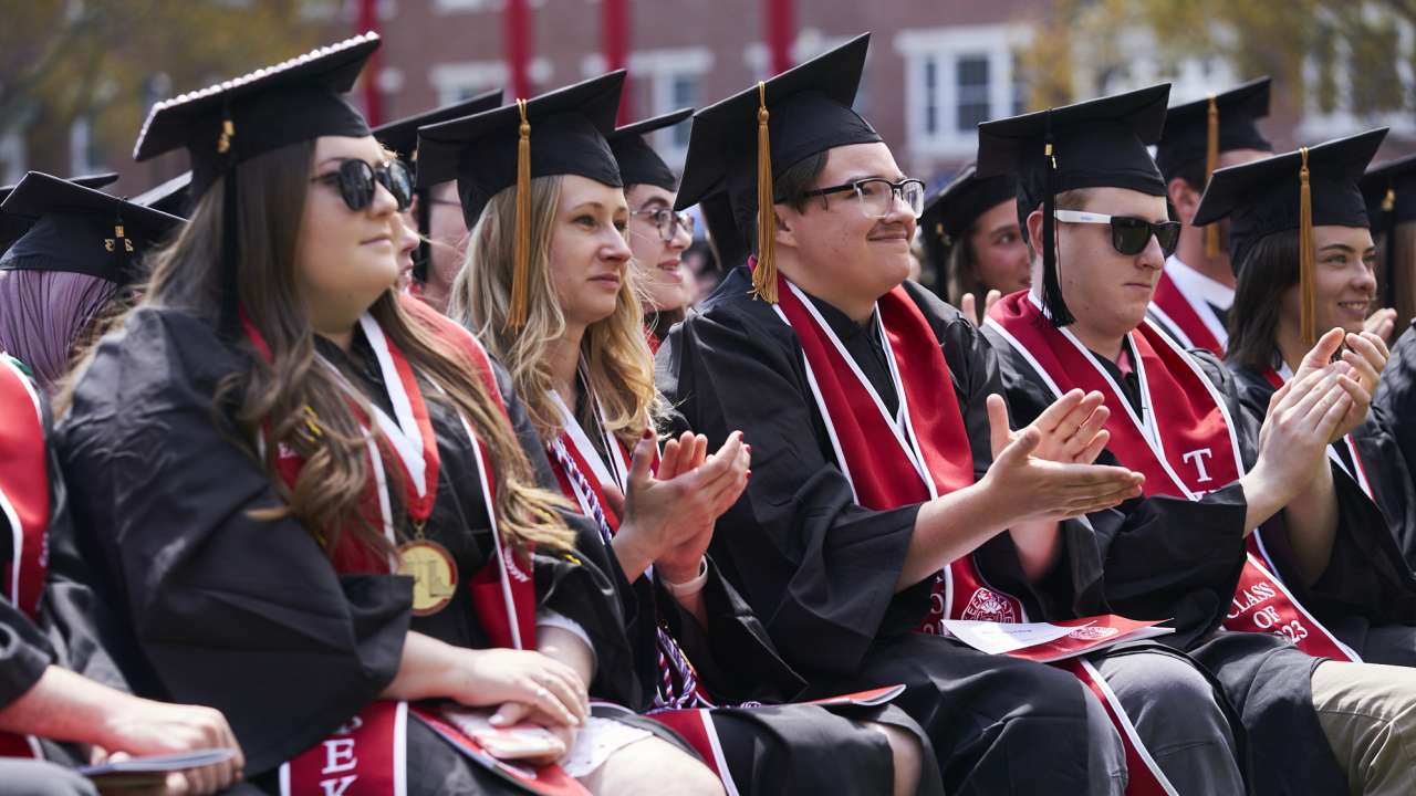 Graduates clap during the 2023 Commencement ceremony