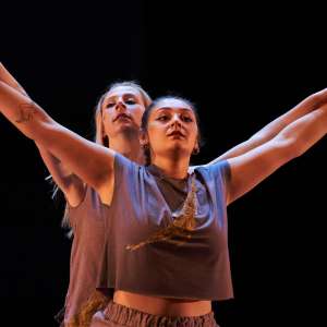 Two female dancers perform on stage during Evening of Dance