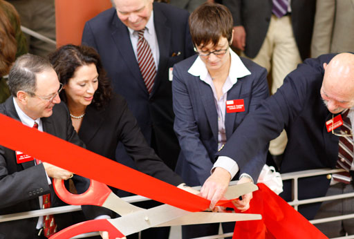 Interim President Jay Kahn is cutting the ribbon at the TDS Center dedication ceremony.